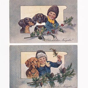 Par de cartões postais antigos: menino com dachshunds
