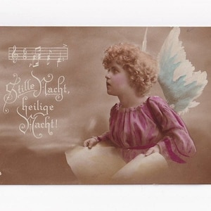 Singender Engel mit Noten des Lieds "Stille Nacht", antike deutsche Postkarte,  Fotografie, 1922