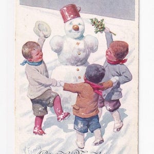 Karl Feiertag: Schneemann mit tanzenden Jungen, antike österreichische Postkarte, 1913 versendet