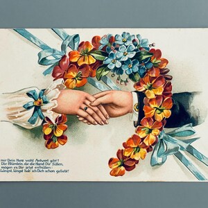 Hände mit Blumen-Hufeisen, antike deutsche Postkarte mit Prägung, 1910 versendet