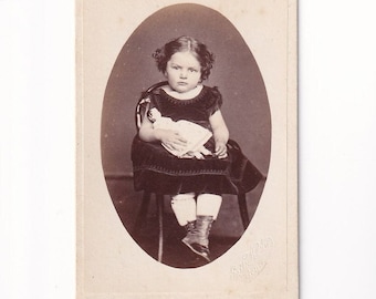 Girl in a velvet dress with a doll, Carte de Visite from Germany by Emil Koch