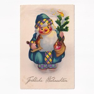 Weihnachtsmann im blauen Mantel mit Kerze und Spielzeugpferd, deutsche Vintage-Postkarte, 1929 versendet