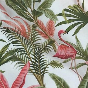 May include: A white background with a pink flamingo and green tropical leaves. The flamingo is standing on one leg and has its head turned to the side. The leaves are in various shades of green and are arranged in a random pattern.