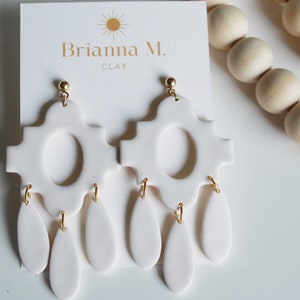 white dangle polymer earrings