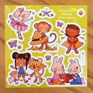 May include: A sticker sheet with the text "CHILDHOOD FRIENDS STICKER SHEET #2" features colorful cartoon illustrations of a ballerina mouse, a monkey, a superhero, a girl, a tiger, and two bunnies. The stickers are on a yellow background.