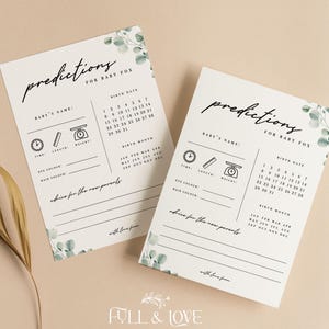 May include: Two white baby prediction cards with eucalyptus leaf accents. The cards have sections for baby's name, time, length, weight, eye color, hair color, and advice for the new parents. The text "predictions for baby fox" is at the top.