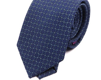 May include: A dark blue patterned tie with a repeating circle design.