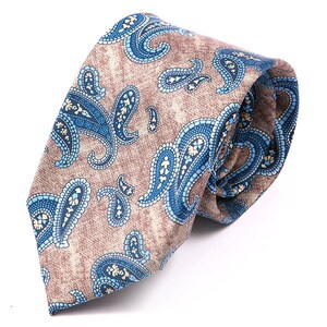 May include: A brown paisley patterned tie with blue and white accents. The tie is made of a silky material and has a classic design.