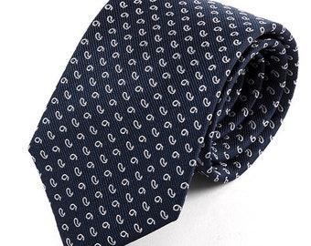May include: A rolled navy blue tie with a white paisley pattern. The tie is made of a smooth fabric and is suitable for formal or business attire. The paisley pattern is evenly spaced across the tie.