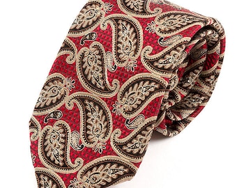 May include: A red paisley patterned tie with brown and gold accents. The tie is made of a silky material and has a classic design.