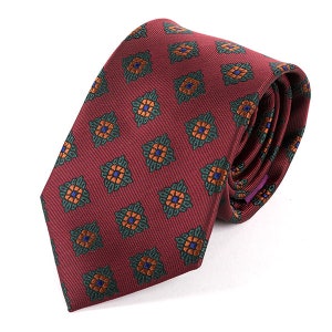 May include: A burgundy silk tie with a repeating pattern of green, orange and blue floral motifs.