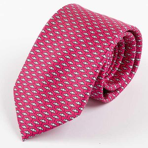 May include: A pink silk tie with a white umbrella pattern.