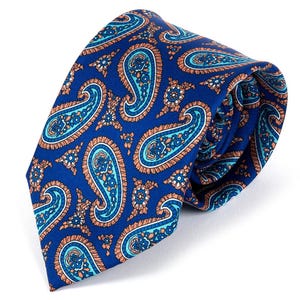May include: A blue paisley tie featuring a repeating pattern of teal, orange, and white teardrop shapes. The tie is knotted, displaying the detailed design and texture of the fabric. The tie is a classic accessory.