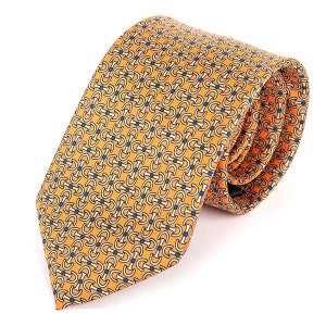 May include: A yellow silk tie with a repeating pattern of blue and white interlocking circles.
