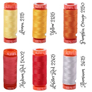 May include: Six spools of Aurifil thread in various colors, including lemon yellow, yellow, orange, red, and gray. Each spool is labeled with the Aurifil logo and the color name and number.