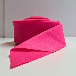 Quilt Binding on the Bias. 2.5” cotton strips folded in half and pressed. Hot Pink. Blanket binding - Baby, Throw, Twin, Queen, King. Cotton