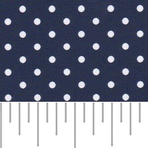 a ruler with white dots on a dark blue background