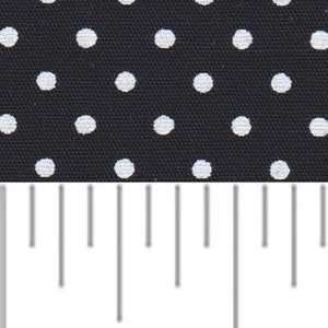 a ruler with white dots on a black background
