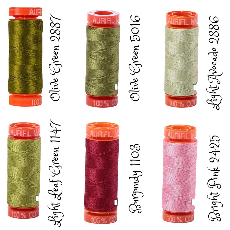 May include: Six spools of 100% cotton thread in various colors, including green, burgundy, and pink. The spools are labeled with the thread color and number.  The thread is made by Aurifil.