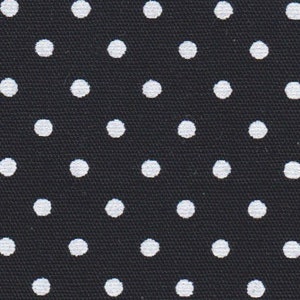 a black tie with white polka dots on it