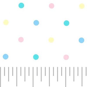 May include: White fabric with a repeating pattern of pastel-colored polka dots. The dots are pink, yellow, and blue. A ruler in inches is at the bottom of the image, showing measurements.