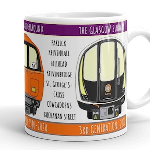 May include: White ceramic mug with a colorful illustration of the Glasgow Subway. The mug features two different train designs, one orange and one white with black accents. The text "The Glasgow Subway" and "3rd Generation: 200" are printed on the mug.