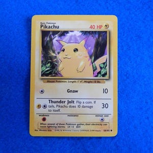 pokemon base set common card 58102 pikachu - 58/102 - Hundreds of beautiful color photographs display the hottest Pokmon collectibles produced for the American market today Pikachu 58/102 Yellow Cheeks Pokemon