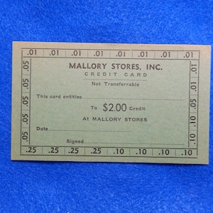 May include: A green credit card for Mallory Stores, Inc. The card entitles the holder to $2.00 credit at Mallory Stores. The card is not transferable.