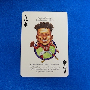 May include: Ace of Spades playing card featuring a cartoon illustration of Patrick Mahomes, a two-time NFL MVP. The card includes text describing his achievements and the year 2017.