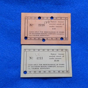 May include: Two vintage merchandise tickets from the Southern Mining Company, Colmar, Kentucky. One is peach-colored, the other is off-white. Both have the text "Highest Amount punched cancels all smaller amounts" and "Good only for merchandise in store".