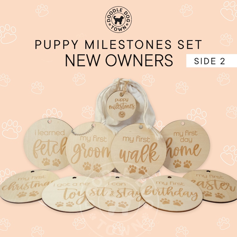 May include: A set of 10 wooden round ornaments with gold lettering and paw prints. The ornaments are for a puppy milestone set for new owners. The ornaments include phrases like "my first walk", "my first groom", "my first home", "my first birthday", "I got a new toy", "I can sit and stay", "my first Christmas", "my first Easter", "I learned fetch".