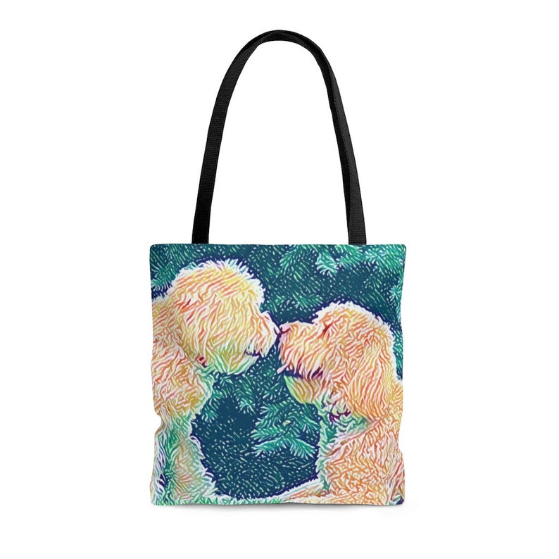 May include: A tote bag featuring a colourful illustration of two golden doodle dogs kissing. The dogs are in front of a green and blue background.