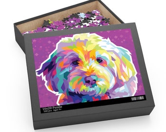 May include: A 500-piece jigsaw puzzle featuring a colorful, abstract portrait of a white dog with a pink background. The puzzle box is black with the text "16x20 Puzzle 500 pcs Ages 9+"