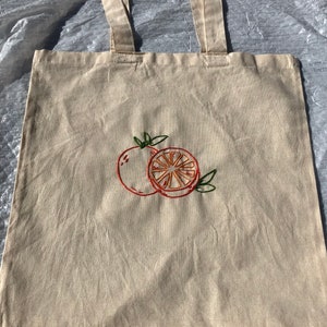 Handmade embroidered orange tote bag