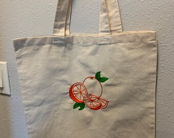 Handmade embroidered orange tote bag