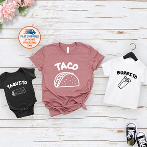 May include: A set of three shirts with a taco, burrito, and taquito design. The shirts are in black, white, and pink.