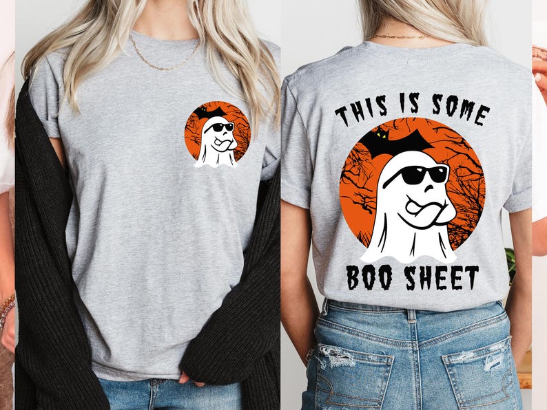 May include: A light gray t-shirt featuring a Halloween-themed design. The front has a circular graphic of a ghost wearing sunglasses. The back of the shirt has the text "THIS IS SOME BOO SHEET" with the same ghost graphic.