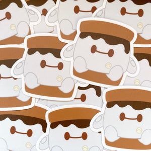 May include: A set of 10 stickers featuring a cartoon character resembling a marshmallow with chocolate and graham cracker. The character has a brown chocolate topping, white marshmallow body, and brown graham cracker base. The stickers are printed on white glossy paper.