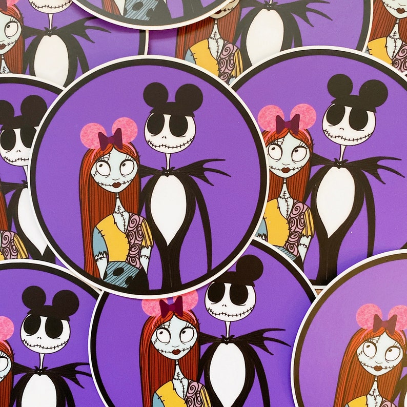 May include: A set of four round stickers featuring a purple background with a cartoon couple. The couple is dressed in black and white with pink bows. The characters are inspired by the Disney characters Jack Skellington and Sally from the movie The Nightmare Before Christmas.