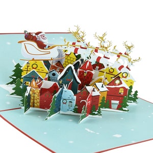 Carte de vœux pop-up de Noël Père Noël en traîneau avec rennes