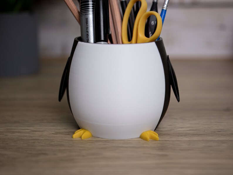 Organize your desk with our whimsical 3D printed Penguin Pen Holder Pots. Perfect for pens and brushes, they also make a thoughtful gift for anyone special.