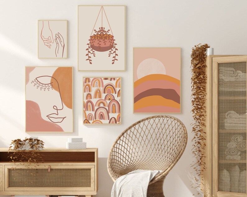 May include: A set of five abstract art prints in a boho style with a color palette of pink, orange, and brown. The prints feature line art, geometric shapes, and a hanging plant.