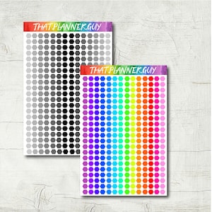 May include: Two sheets of hexagon shaped stickers. One sheet has a gradient of gray hexagons. The other sheet has a rainbow gradient of hexagons. The text "THAT PLANNER.GUY" is at the top of each sheet.