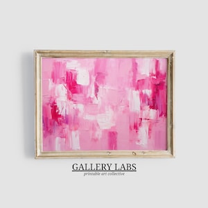 Könnte beinhalten: Ein abstraktes Gemälde mit dicken, strukturierten Pinselstrichen in verschiedenen Rosa-, Magenta- und Weißtönen, eingefasst in einen hellen Holzrahmen. Das Kunstwerk zeigt eine geschichtete Komposition aus lebendigen Farben und sichtbarer Textur.