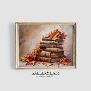 Puede incluir: Una pintura al óleo de una pila de libros antiguos con hojas de otoño naranjas y rojas. Los libros son de varios tonos marrones y beige, y las hojas están esparcidas alrededor de la pila. La obra de arte está enmarcada y tiene el texto "GALLERY LABS printable art collective".