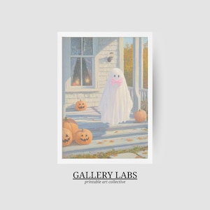 May include: A vertical art print featuring a painting of a white ghost wearing a pink bow standing on a porch with orange jack-o'-lanterns. The scene includes a house exterior with a window and autumn leaves. The text GALLERY LABS is at the bottom.