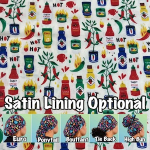 May include: A white fabric featuring a repeating pattern of chili pepper plants, hot sauce bottles, and flames, with the text "Satin Lining Optional" at the bottom, alongside five images showing the fabric styled as various head coverings.