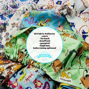 May include: A collection of fabric patterns featuring cartoon characters, including Spongebob Squarepants, Simba, and others. The image includes text indicating 63 fabric patterns are available, with options for euro, tie back, bouffant, ponytail, and high bun styles. Satin lining is optional.