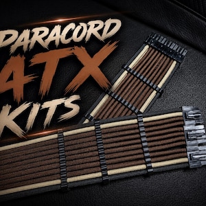 May include: A set of computer power supply cables wrapped in brown, tan, and black paracord with black plastic cable combs. The text PARACORD ATX KITS is displayed in large, stylized brown and white lettering over the cable assembly.