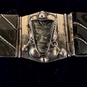 Sterling silver and obsidian Taxco panel bracelet with 4 Aztec stone faces